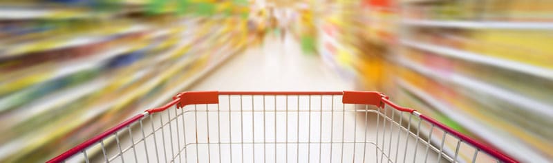 supermarket aisle with empty red shopping cart; hidden water